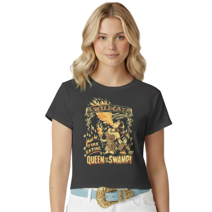 Woman wearing a black t-shirt with graphic design and white shorts on a white background